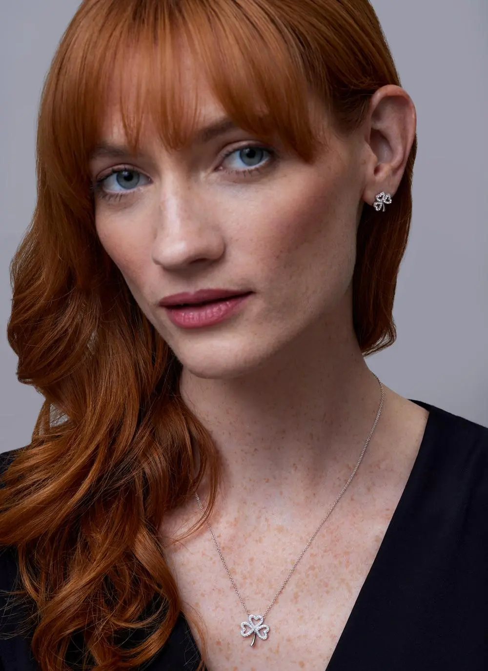 Red haired model wearing Sterling Silver Open Shamrock Pendant With Swarovski Crystals